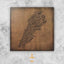 Carved wood artwork of the Lebanon map, carved in Diwani calligraphy featuring the names of its cities.