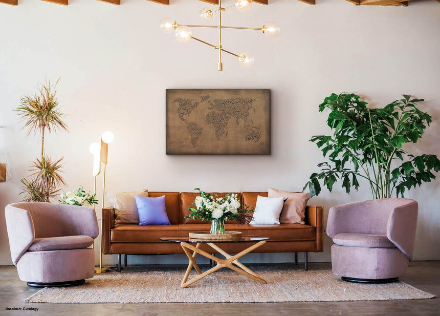 a living room filled with furniture and a painting on the wall