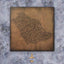 Carved wood artwork of the Saudi Arabia map, drawn in Diwani calligraphy using the names of its cities.