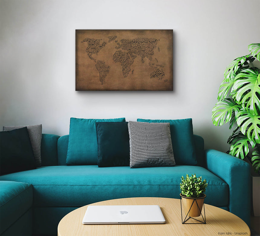 a living room with a blue couch and a map on the wall
