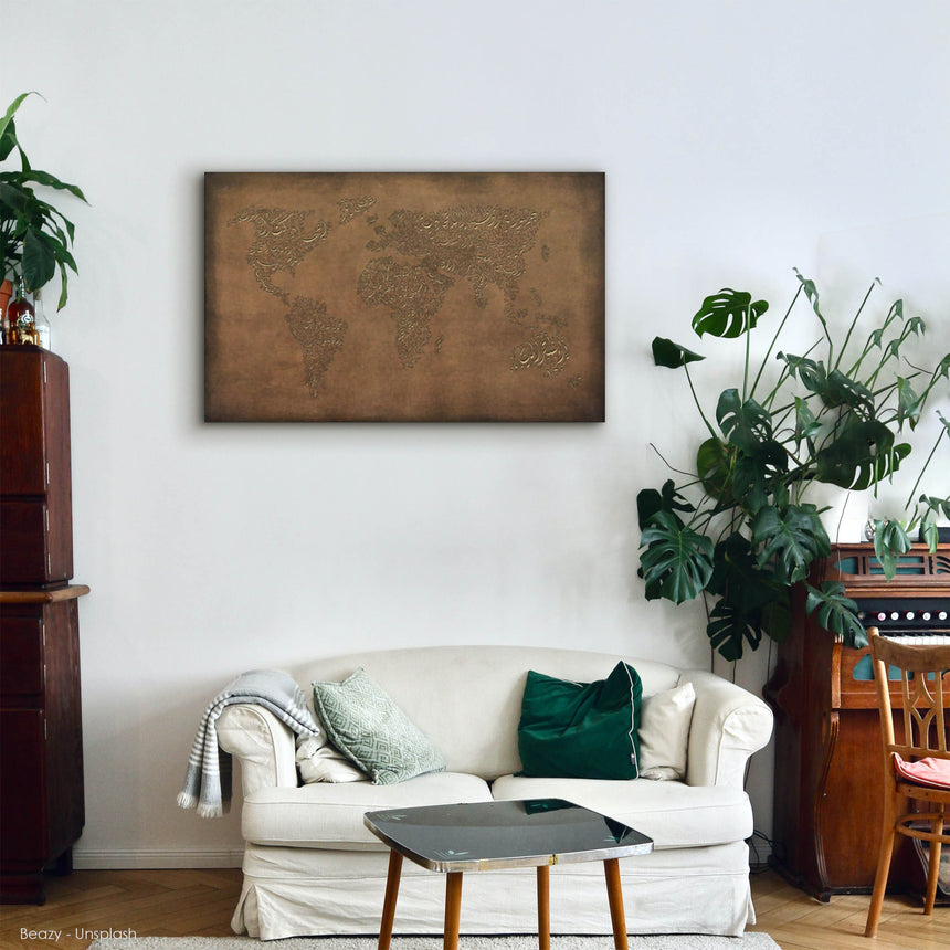 a living room with a white couch and a map on the wall