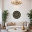 a living room with a couch, coffee table and a chandelier